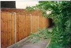 Very strong 6ft closeboard fence with made to order 5&quot; x 4&quot; concrete morticed posts and concrete gravel boards.