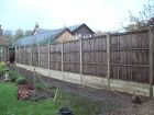 A very heavy duty 8ft fence with a retaining timber gravel board to hold back higher soil level in neighbour&#039;s garden behind.